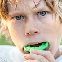 child wearing sports mouth guard